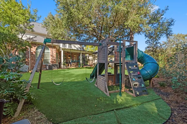 a view of a park with large trees