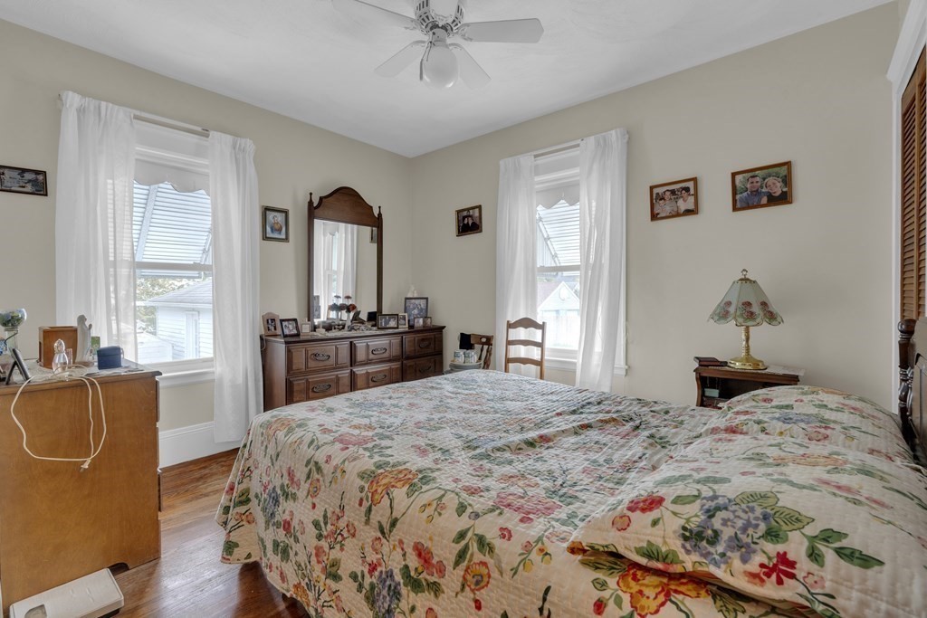 67 Bruce Road Waltham, MA 02453 - Photo 9 of 17 a bedroom with a bed and dresser with mirror