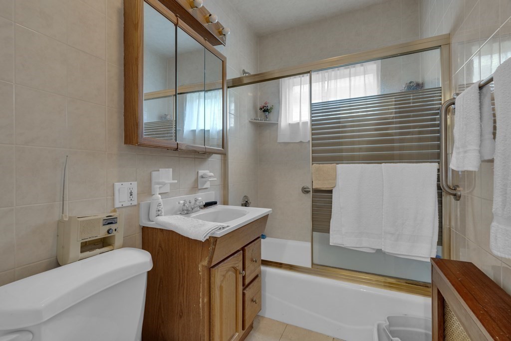 67 Bruce Road Waltham, MA 02453 - Photo 10 of 17 a bathroom with a sink a toilet and shower