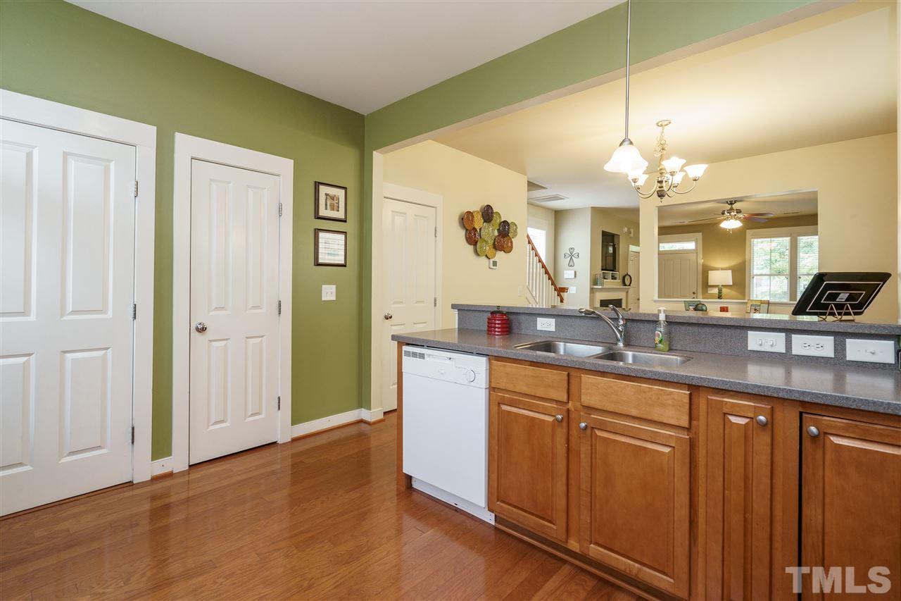 4422 Crystal Breeze Street Raleigh, NC 27614 - Photo 13 of 25 a large bathroom with a large mirror vanity and sink