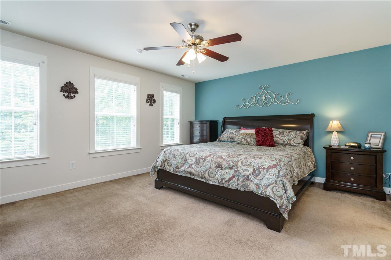 4422 Crystal Breeze Street Raleigh, NC 27614 - Photo 15 of 25 a bedroom with a bed and window
