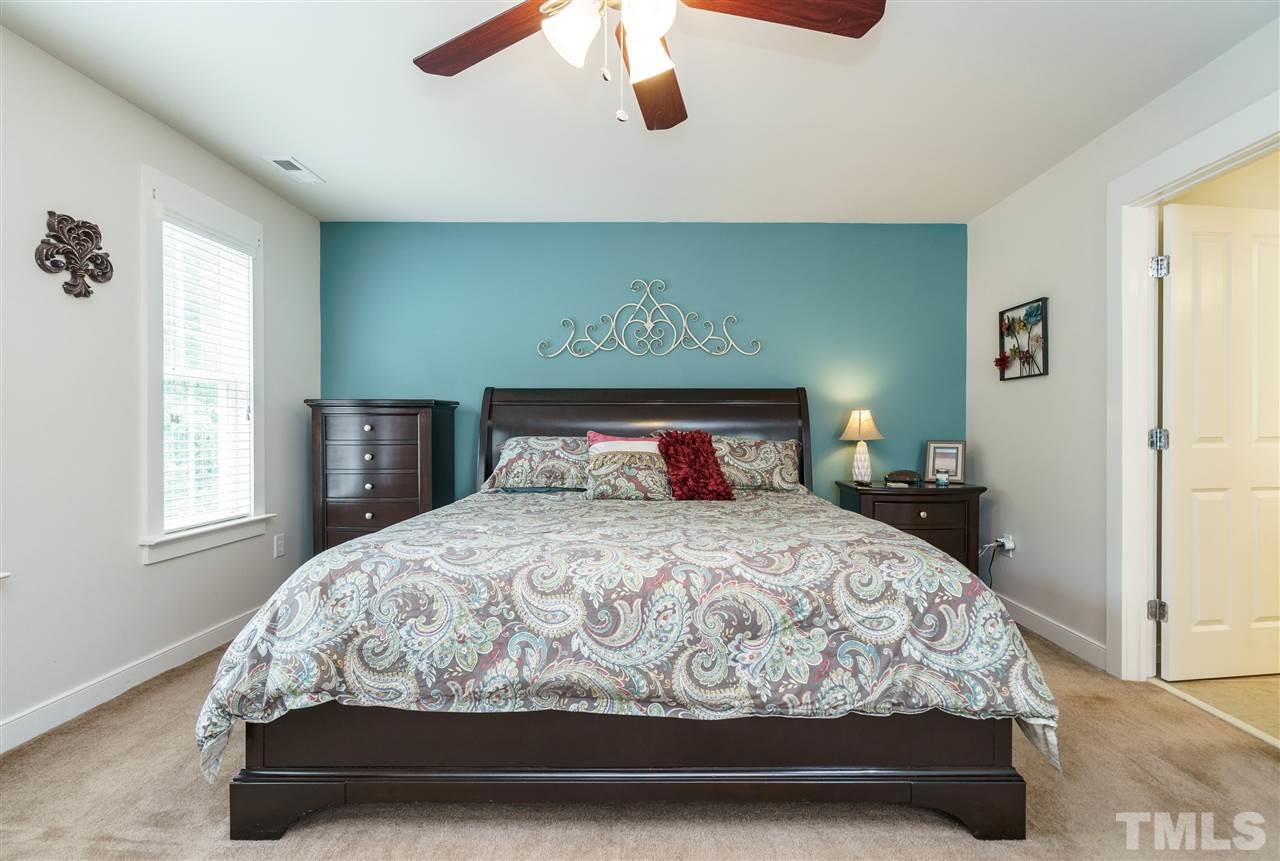 4422 Crystal Breeze Street Raleigh, NC 27614 - Photo 16 of 25 a bedroom with a bed and window