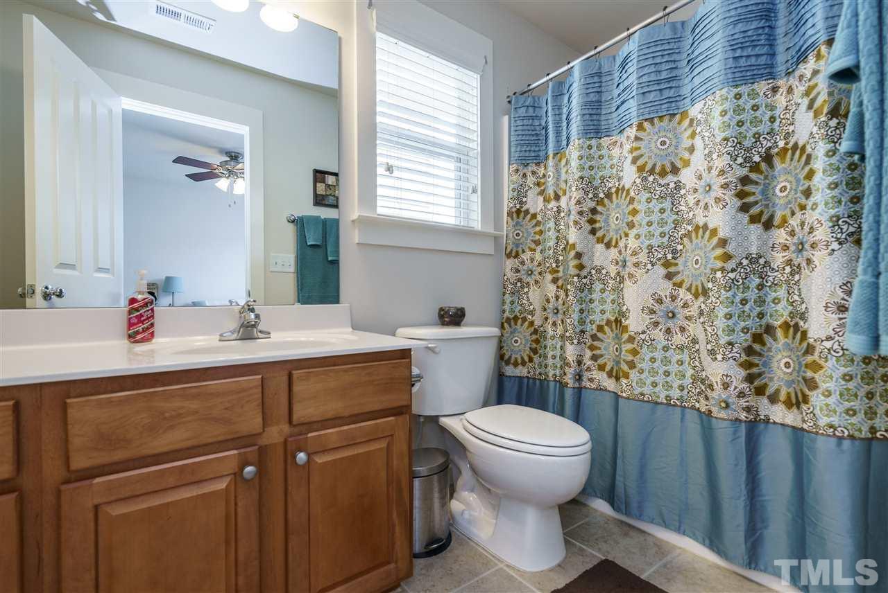 4422 Crystal Breeze Street Raleigh, NC 27614 - Photo 21 of 25 a bathroom with a sink toilet and shower