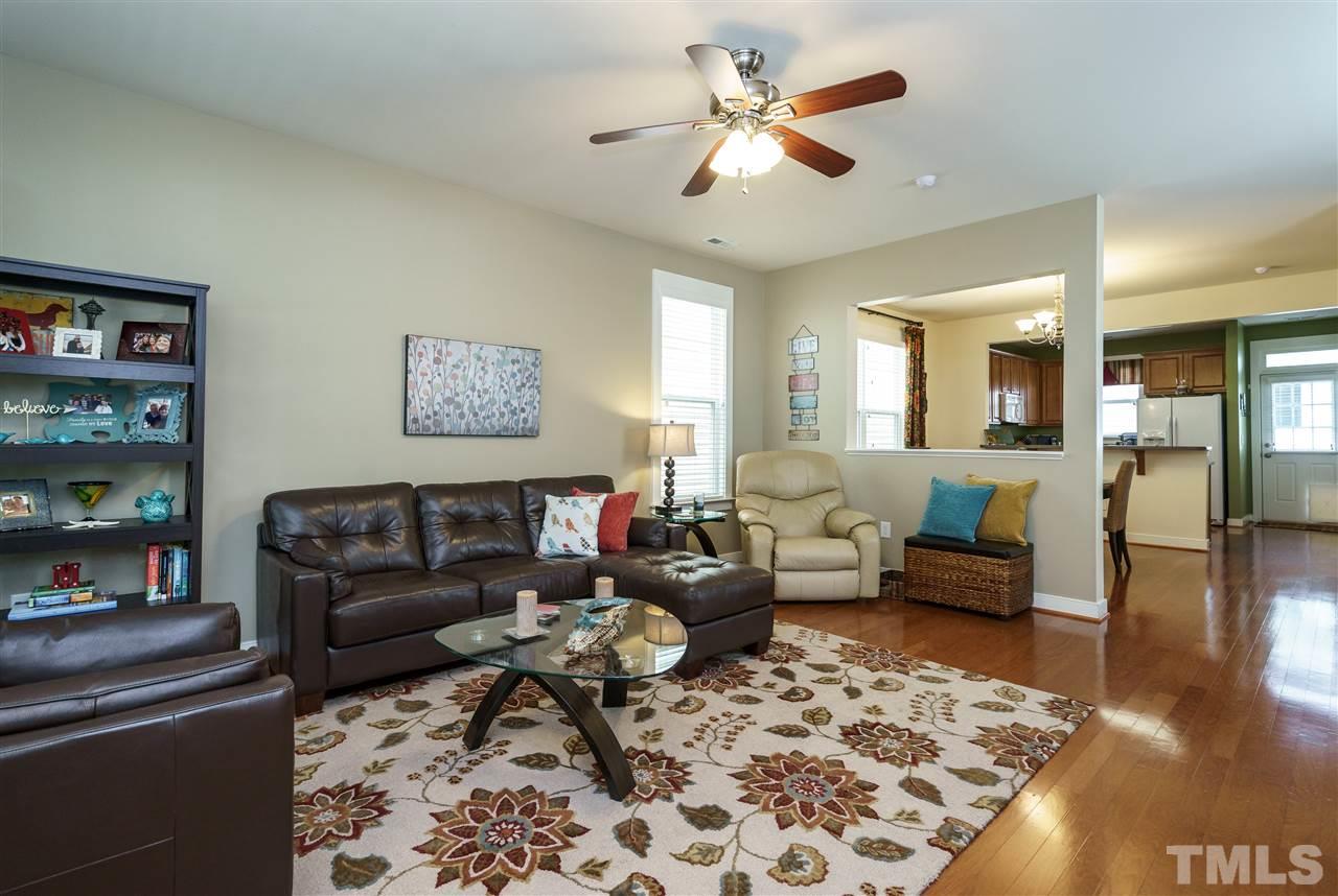 4422 Crystal Breeze Street Raleigh, NC 27614 - Photo 4 of 25 a living room with furniture and a rug