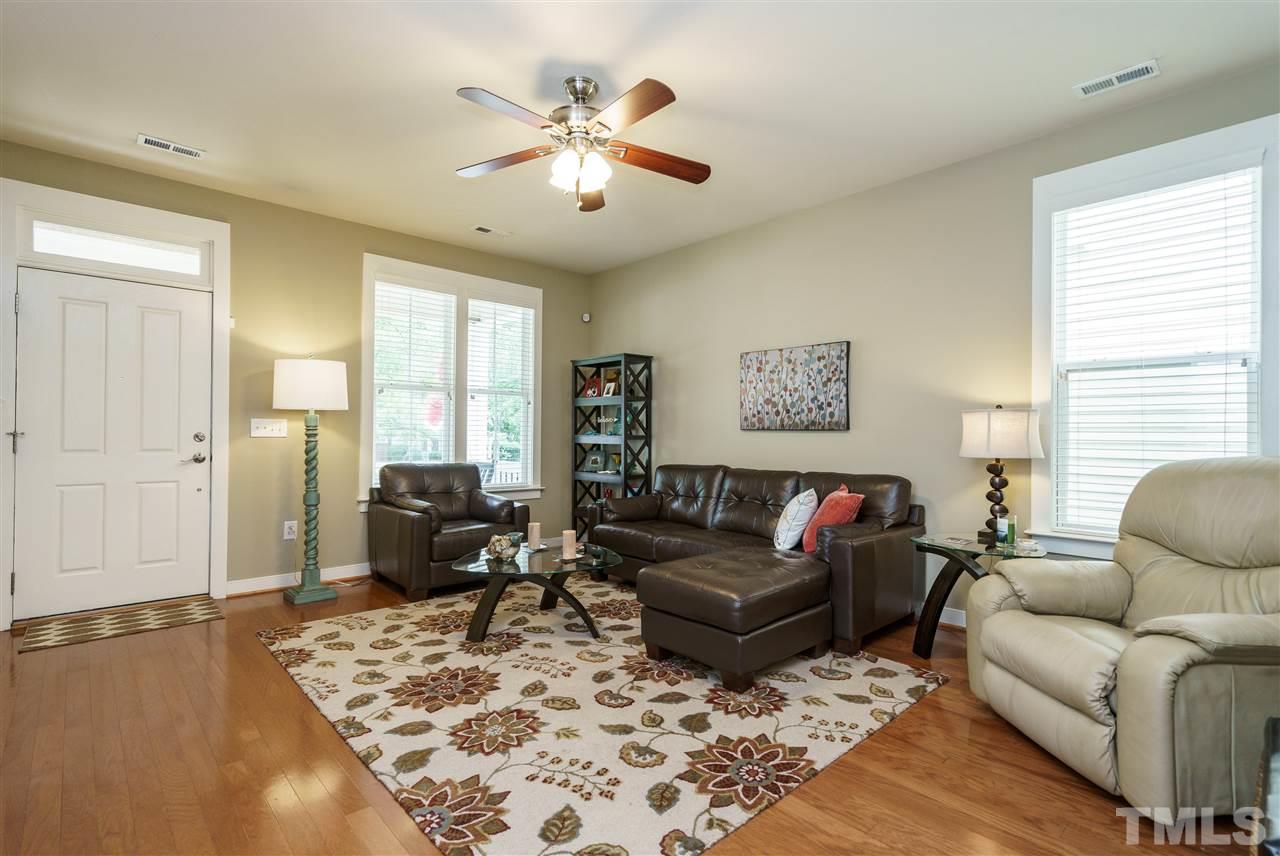 4422 Crystal Breeze Street Raleigh, NC 27614 - Photo 6 of 25 a living room with furniture window and wooden floor