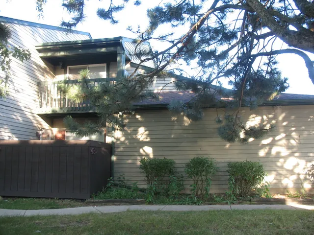 a kitchen with a refrigerator stove and white cabinets