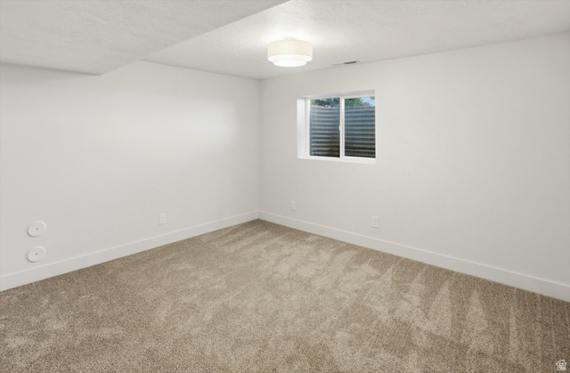 8760 Rustler Road Cottonwood Heights, UT 84093 - Photo 40 of 57 Neutral-toned carpeting throughout