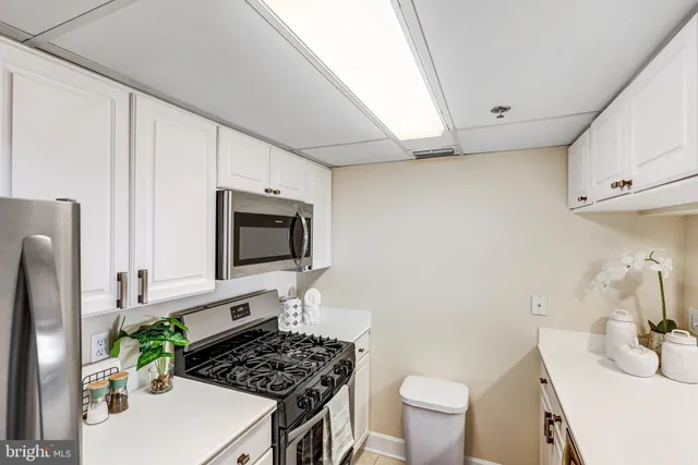 a living room with furniture a fireplace and a counter top space
