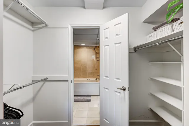a bathroom with a sink a mirror and a shower