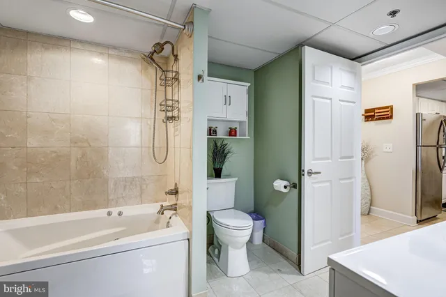 a spacious bathroom with a double vanity sink and a mirror