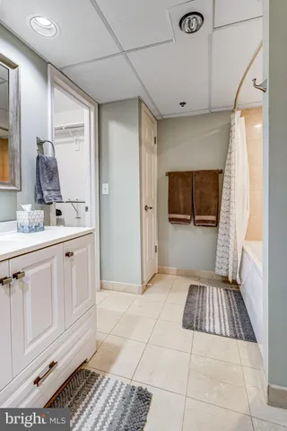 a view of living room with furniture and walk in closet