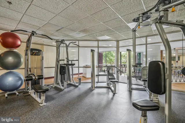 a bed room with furniture and a large window