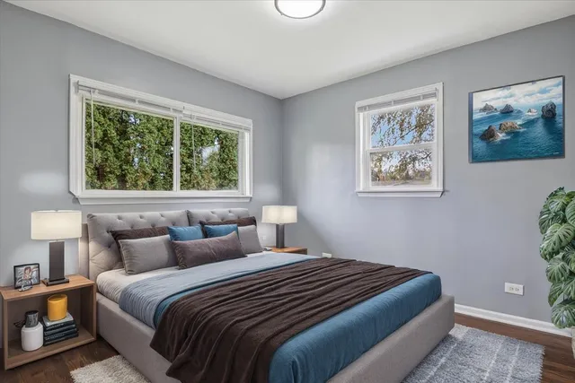 a bedroom with bed and window