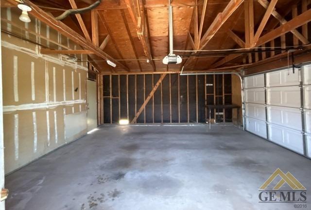 Undisclosed Address Delano, CA 93215 - Photo 11 of 14 a view of an empty room with wooden walls