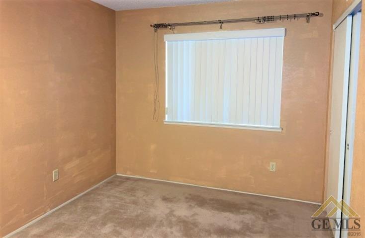 Undisclosed Address Delano, CA 93215 - Photo 8 of 14 a view of an empty room with a window