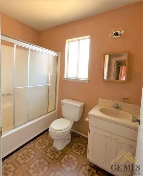 Undisclosed Address Delano, CA 93215 - Photo 9 of 14 a bathroom with a toilet a sink and a window