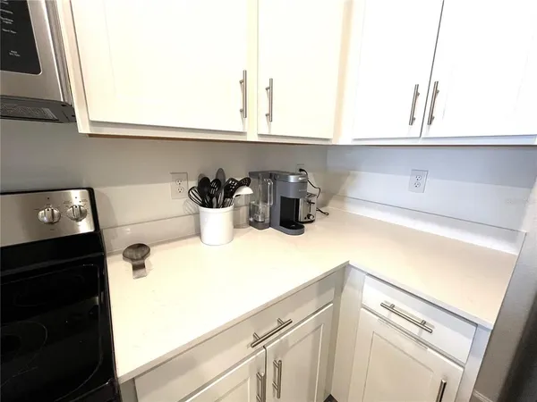 a kitchen with a sink and cabinets