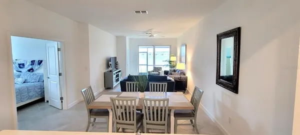 a view of a dining room with furniture and window