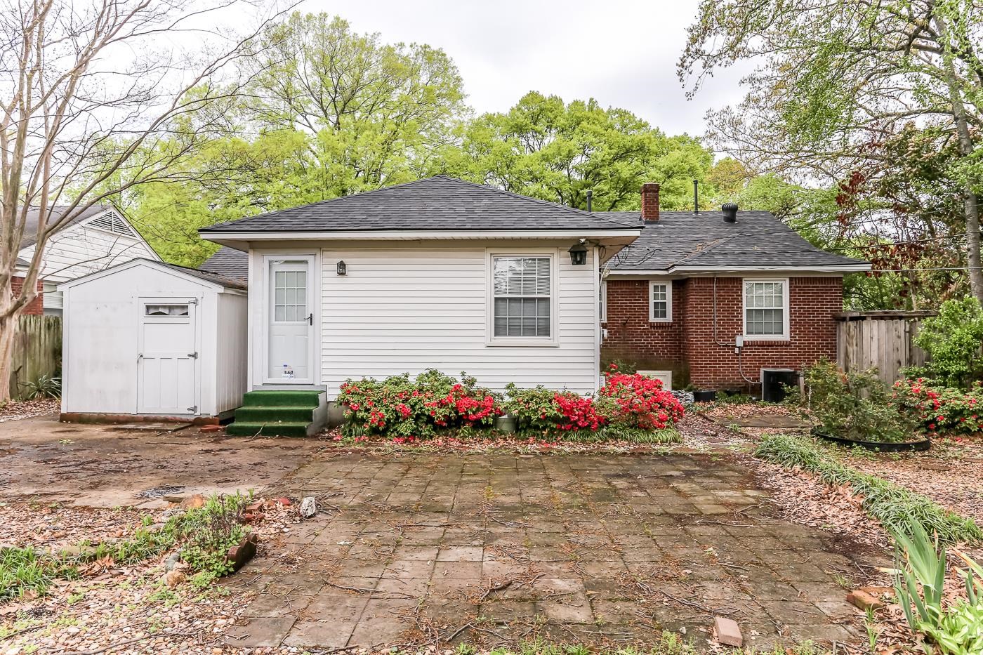 4969 Amboy Road Memphis, TN 38117 - Photo 16 of 19 a front view of house with flowers