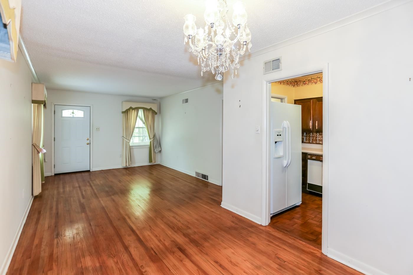 4969 Amboy Road Memphis, TN 38117 - Photo 4 of 19 a view of empty room with wooden floor and fan