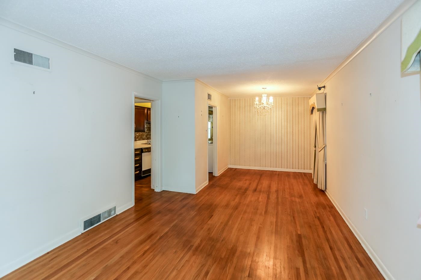 4969 Amboy Road Memphis, TN 38117 - Photo 5 of 19 a view of a room with wooden floor and a bathroom
