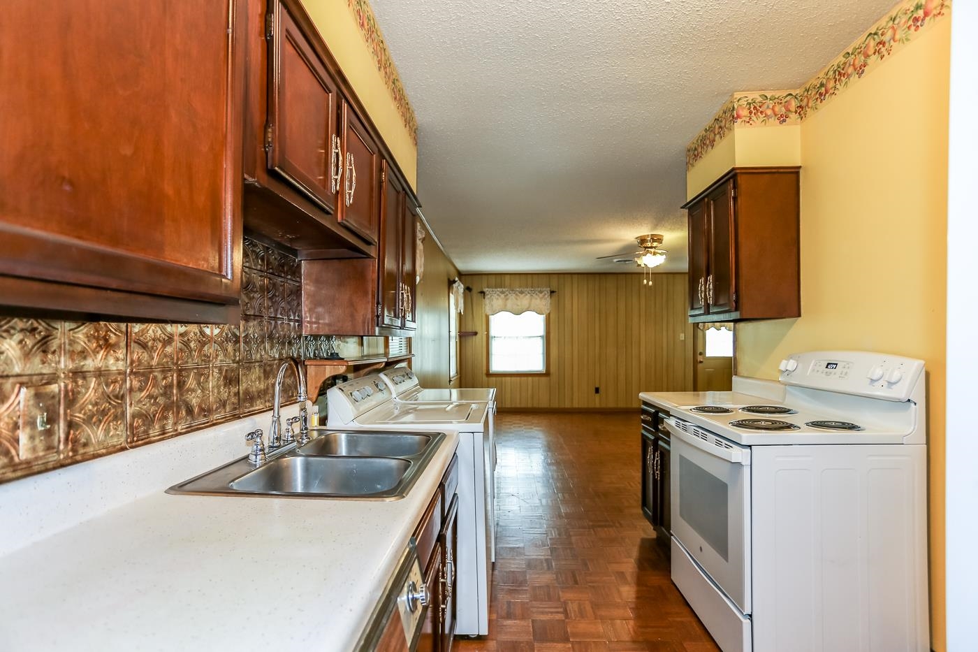 4969 Amboy Road Memphis, TN 38117 - Photo 6 of 19 a kitchen with stainless steel appliances granite countertop a sink a stove and a refrigerator