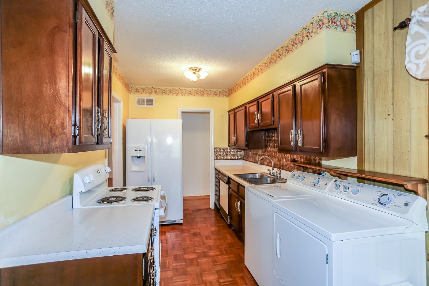 4969 Amboy Road Memphis, TN 38117 - Photo 7 of 19 a kitchen with a sink stove and refrigerator
