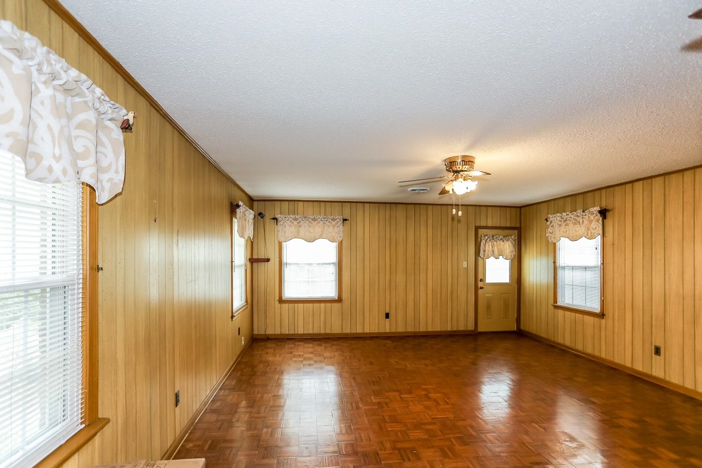 4969 Amboy Road Memphis, TN 38117 - Photo 8 of 19 a view of a livingroom with wooden floor and windows