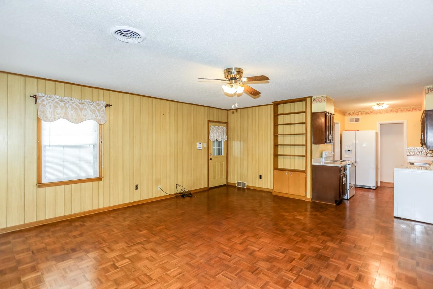 4969 Amboy Road Memphis, TN 38117 - Photo 9 of 19 wooden floor in an empty room with a window