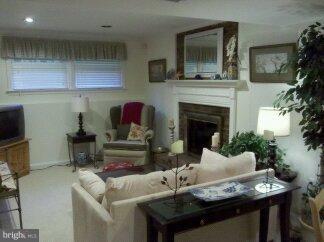 2676 Walston Road Mount Airy, MD 21771 - Photo 12 of 28 a living room with furniture and a fireplace