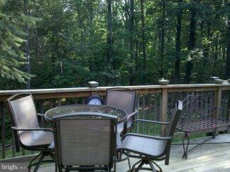 2676 Walston Road Mount Airy, MD 21771 - Photo 14 of 28 a view of a chair and table on the deck