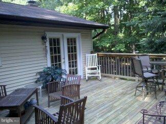 2676 Walston Road Mount Airy, MD 21771 - Photo 19 of 28 a view of a chair and table on the wooden deck