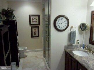 2676 Walston Road Mount Airy, MD 21771 - Photo 24 of 28 a bathroom with a granite countertop toilet and a sink