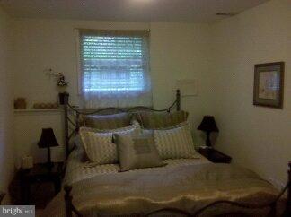 2676 Walston Road Mount Airy, MD 21771 - Photo 25 of 28 a living room with furniture and a window
