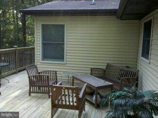 2676 Walston Road Mount Airy, MD 21771 - Photo 26 of 28 a brick house with table and chairs