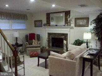 2676 Walston Road Mount Airy, MD 21771 - Photo 4 of 28 a living room with furniture and a fireplace
