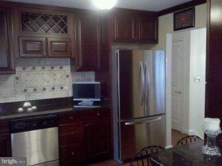 2676 Walston Road Mount Airy, MD 21771 - Photo 6 of 28 a kitchen with stainless steel appliances granite countertop a refrigerator and a stove top oven