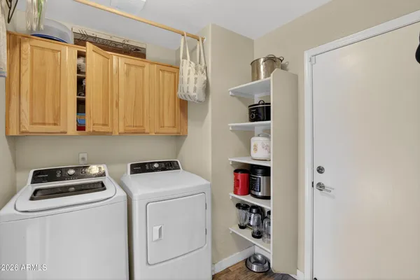 a view of storage and utility room with washer and dryer