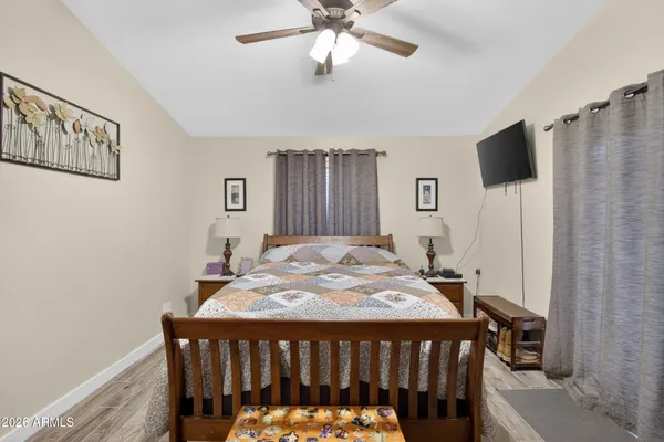 a bedroom with a bed and a table