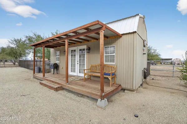 a living room with furniture and a chair