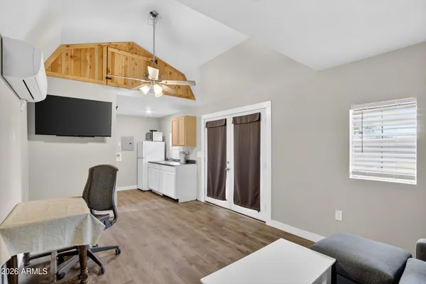a kitchen with stainless steel appliances granite countertop a sink and a refrigerator