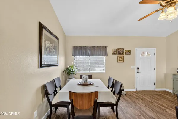 a view of a dining room with furniture and window