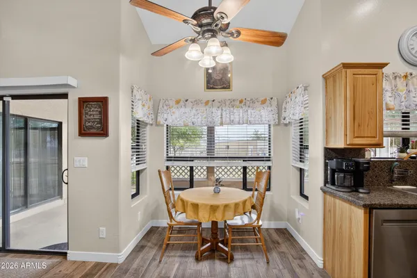 a dining room with furniture and window