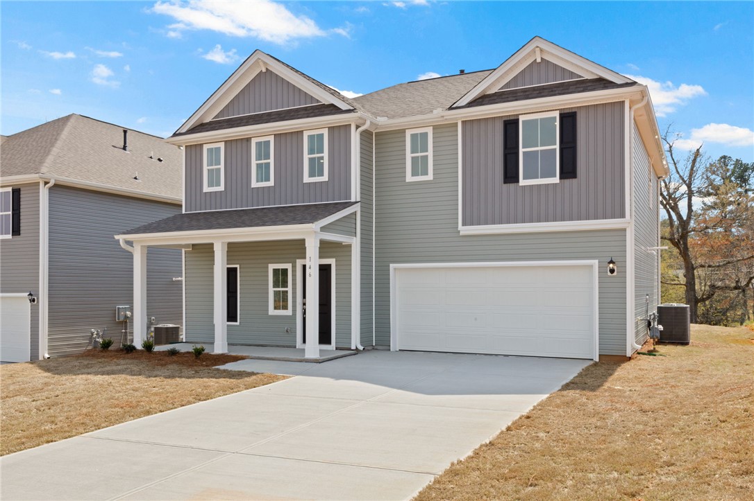 146 Cedar Shoals Easley, SC 29640 - Photo 2 of 34 This newly constructed residence features an inviting front porch and a spacious attached garage.