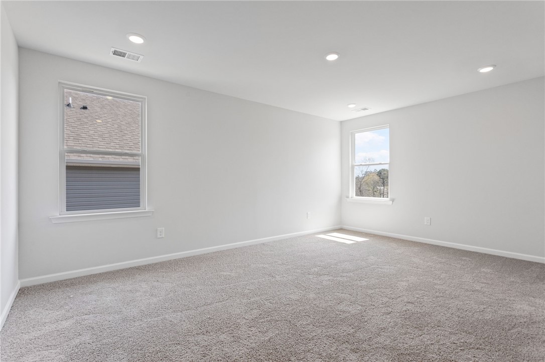 146 Cedar Shoals Easley, SC 29640 - Photo 21 of 34 This spacious room features ample natural light and plush carpeting, perfect for a cozy retreat.
