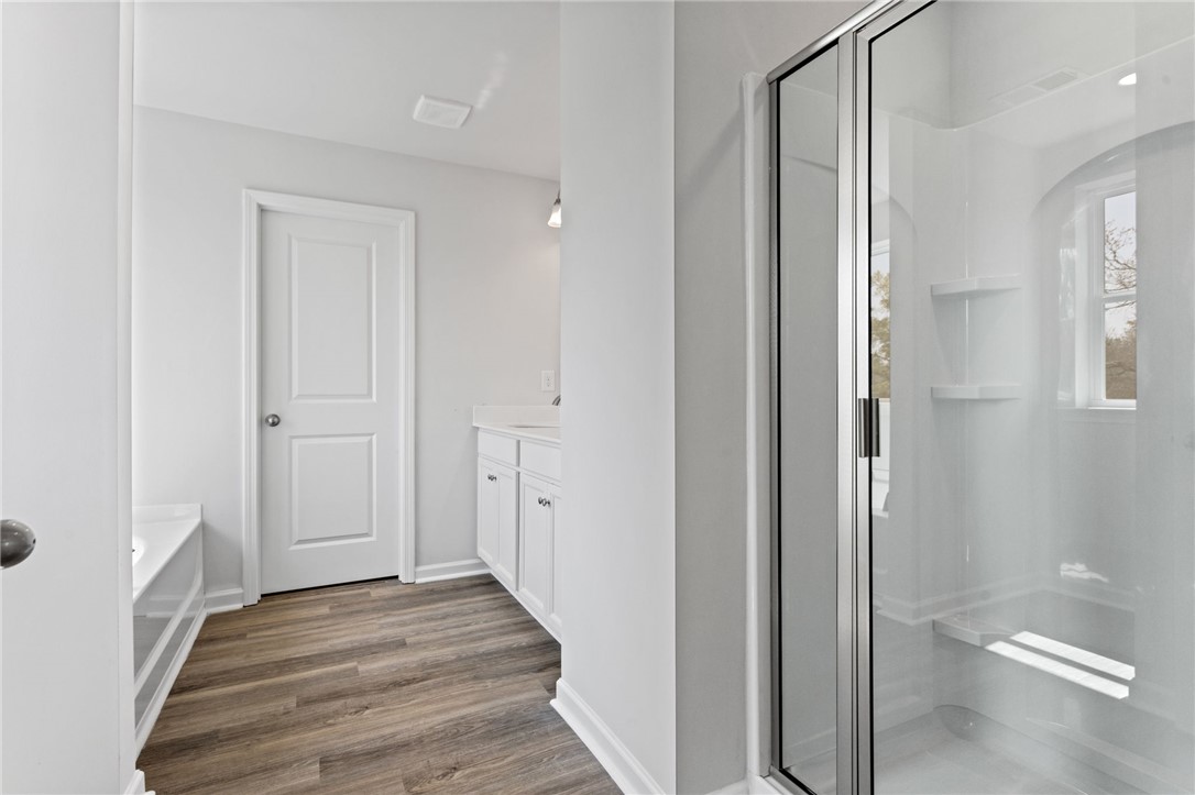 146 Cedar Shoals Easley, SC 29640 - Photo 23 of 34 This modern bathroom features a sleek glass shower and practical vanity storage.