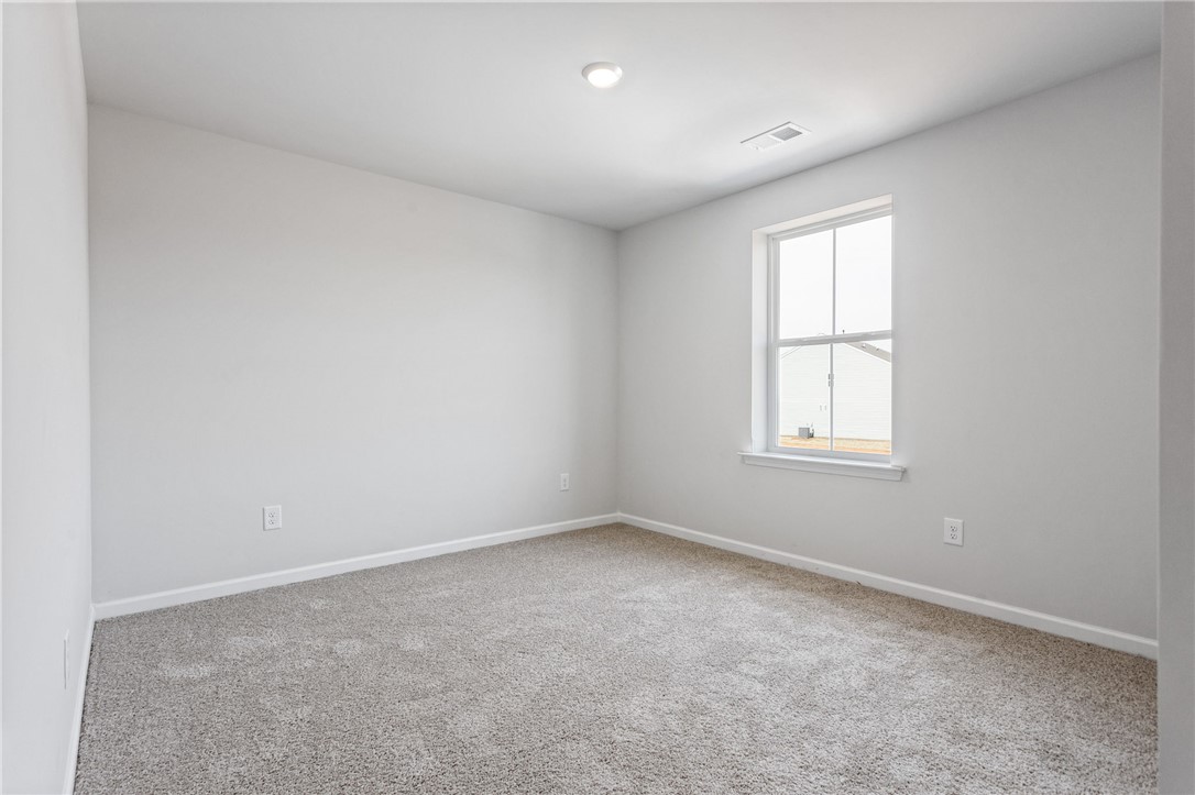 146 Cedar Shoals Easley, SC 29640 - Photo 27 of 34 This serene bedroom offers a peaceful retreat with ample natural light.