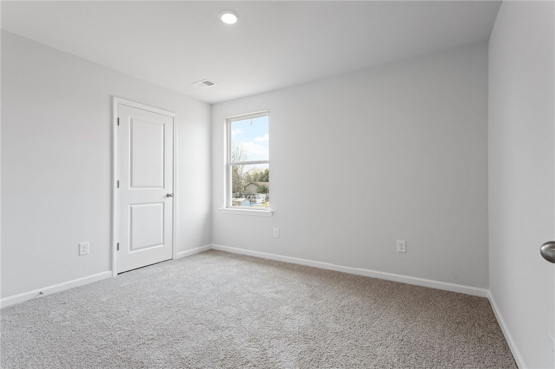 146 Cedar Shoals Easley, SC 29640 - Photo 29 of 34 This serene bedroom offers a tranquil retreat with ample natural light.