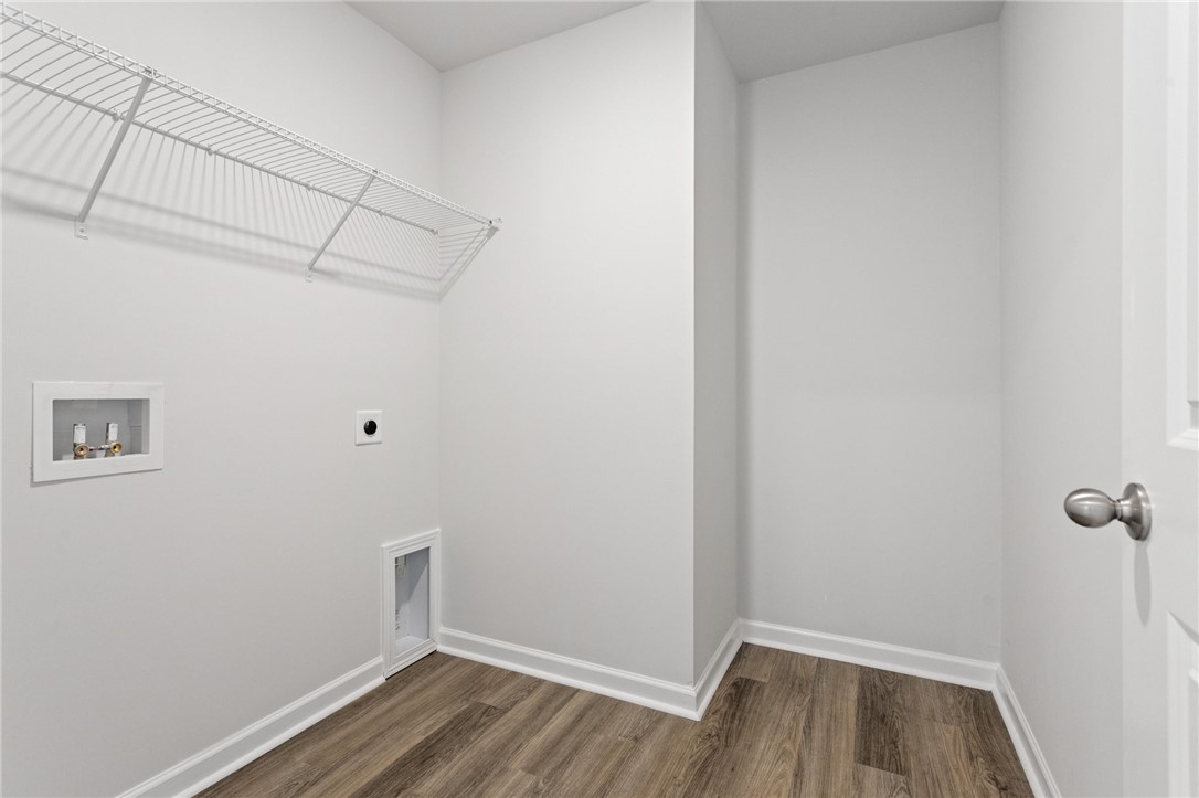 146 Cedar Shoals Easley, SC 29640 - Photo 31 of 34 Functional laundry space with easy-care flooring and convenient wall shelving.