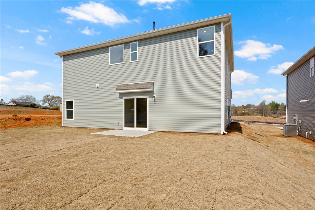 146 Cedar Shoals Easley, SC 29640 - Photo 34 of 34 This newly constructed residence features a spacious yard and inviting sliding glass doors.